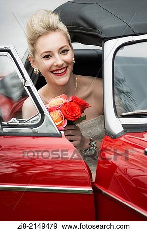 Stock Photo - Blond bride with a flower bouquet.. Fotosearch