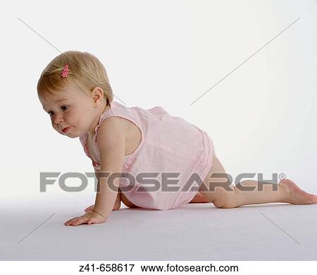 Blond little girl crawling View Large Photo Image Stock Photo - Blond little girl crawling. Fotosearch