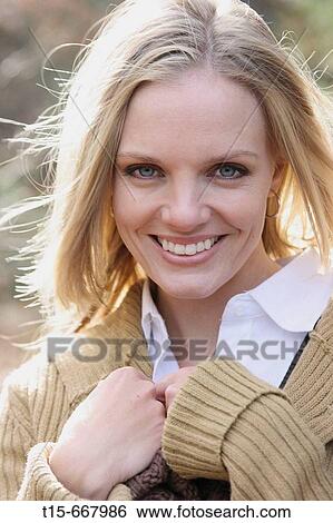 Blond woman in her 20's 30's smiling at camera View Large Photo Image Stock Photograph - Blond woman in her 20's 30's smiling at camera. Fotosearch