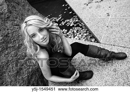 Blond woman sitting View Large Photo Image Stock Image - Blond woman sitting. Fotosearch