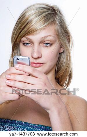 Blond Woman Texting on Mobile Phone View Large Photo Image Stock Image - Blond Woman Texting on Mobile Phone. Fotosearch