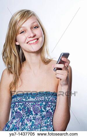 Blond Woman Texting on Mobile Phone View Large Photo Image Stock Photography - Blond Woman Texting on Mobile Phone. Fotosearch