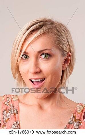 Blond woman with facial expression View Large Photo Image Stock Image - Blond woman with facial expression. Fotosearch
