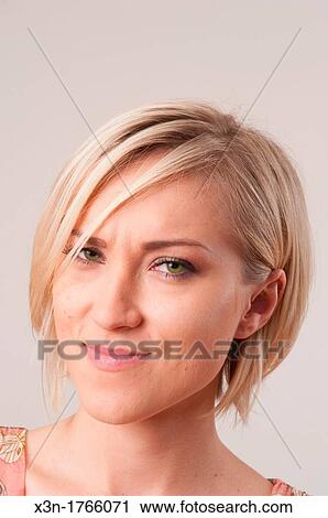 Blond woman with facial expression View Large Photo Image Stock Image - Blond woman with facial expression. Fotosearch