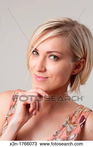 Blond woman with facial expression View Large Photo Image Stock Image - Blond woman with facial expression. Fotosearch