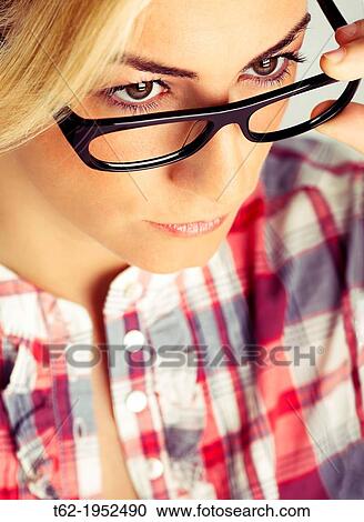 Blond young woman with glasses. Color. View Large Photo Image Stock Image - Blond young woman with glasses. Color.. Fotosearch