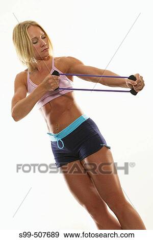 Stock Photo - Blonde caucasian american female fitness model, action. Fotosearch