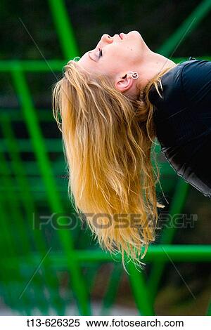 Blonde girl showing her long hair upside-down View Large Photo Image Stock Photography - Blonde girl showing her long hair upside-down. Fotosearch