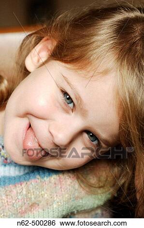 Blonde girl tongue sticking out View Large Photo Image Stock Photograph - Blonde girl tongue sticking out. Fotosearch