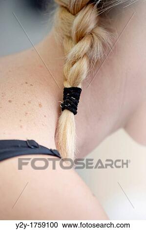 Stock Image - Blonde girl with braids. Fotosearch
