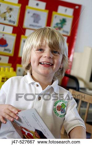 blonde haired, 4 year old boy smiling off camera at nursery View Large Photo Image Stock Photo - blonde haired, 4 year old boy smiling off camera at nursery. Fotosearch