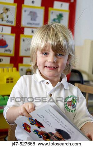 blonde haired, 4 year old boy smiling into camera at nursery View Large Photo Image Stock Photo - blonde haired, 4 year old boy smiling into camera at nursery. Fotosearch