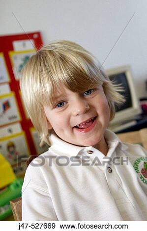 blonde haired, 4 year old boy smiling into camera at nursery View Large Photo Image Stock Photo - blonde haired, 4 year old boy smiling into camera at nursery. Fotosearch