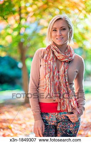 Blonde haired woman outdoors View Large Photo Image Stock Photo - Blonde haired woman outdoors. Fotosearch