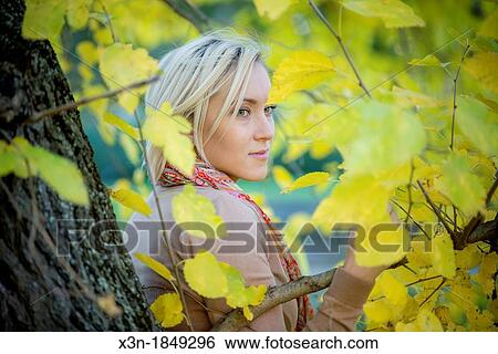 Blonde haired woman outdoors View Large Photo Image Stock Photograph - Blonde haired woman outdoors. Fotosearch