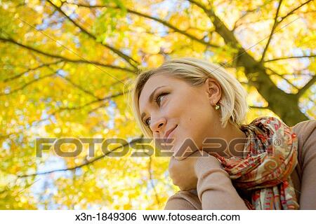 Blonde haired woman outdoors View Large Photo Image Stock Photograph - Blonde haired woman outdoors. Fotosearch