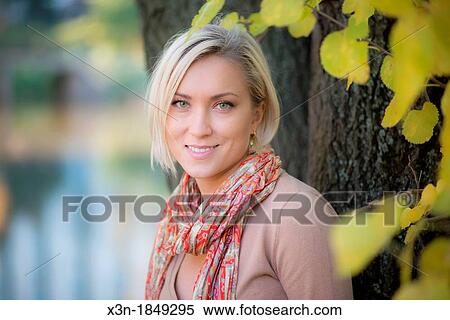 Stock Photography - Blonde haired woman outdoors. Fotosearch