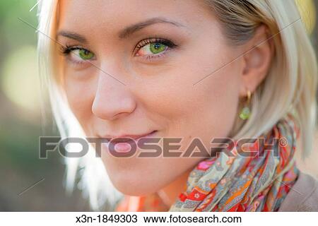 Blonde haired woman with green eyes outdoors View Large Photo Image Stock Image - Blonde haired woman with green eyes outdoors. Fotosearch