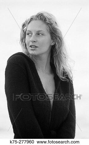 Stock Image - blonde in black sweater. Fotosearch