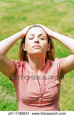 Blonde woman enjoying the sun in the park View Large Photo Image Stock Image - Blonde woman enjoying the sun in the park. Fotosearch