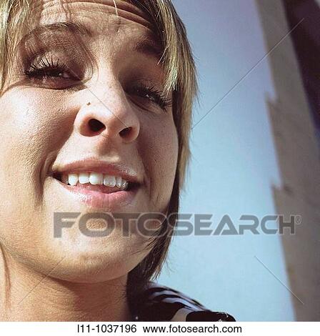 Blonde woman in close-up View Large Photo Image Stock Photograph - Blonde woman in close-up. Fotosearch