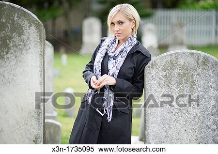 Blonde woman in graveyard View Large Photo Image Stock Photography - Blonde woman in graveyard. Fotosearch