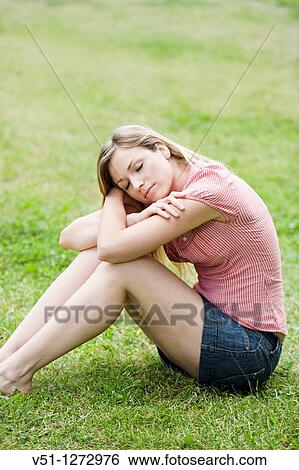 Blonde woman relaxing in PArk View Large Photo Image Stock Photograph - Blonde woman relaxing in PArk. Fotosearch