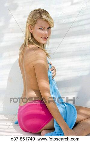 Stock Photo - Blonde woman showing her body. Fotosearch