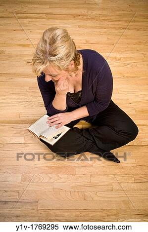 Blonde woman sitting on the floor View Large Photo Image Stock Photography - Blonde woman sitting on the floor. Fotosearch