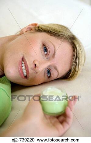 Blonde woman with cosmetic View Large Photo Image Stock Image - Blonde woman with cosmetic. Fotosearch