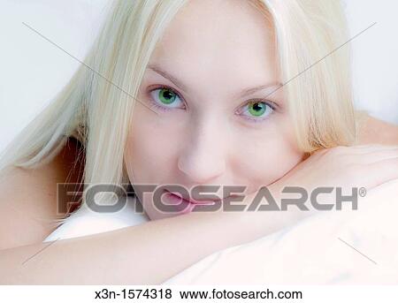 Blonde woman with green eyes View Large Photo Image Stock Photo - Blonde woman with green eyes. Fotosearch