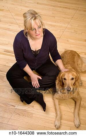 Blonde woman with her dog View Large Photo Image Stock Photo - Blonde woman with her dog. Fotosearch