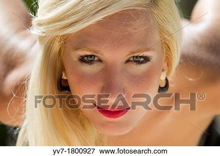 Blonde young girl looking at the camera View Large Photo Image Stock Photo - Blonde young girl looking at the camera. Fotosearch