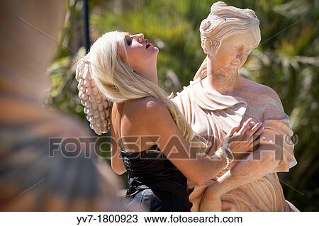 Blonde young girl posing including sculptures View Large Photo Image Stock Image - Blonde young girl posing including sculptures. Fotosearch