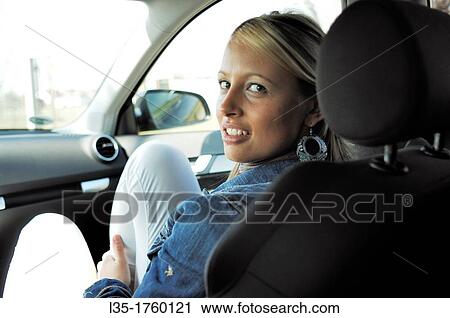 Blonde young woman in a car View Large Photo Image Stock Image - Blonde young woman in a car. Fotosearch
