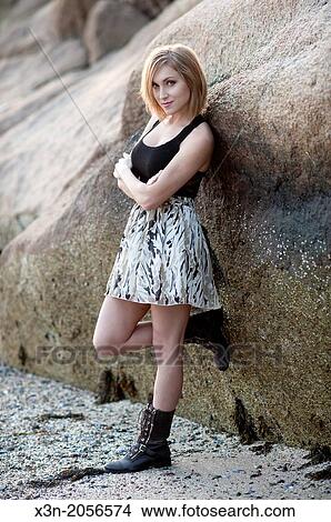 Picture - Blonde young woman on beach in Maine.. Fotosearch