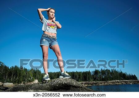 Blonde young woman on beach in Maine. View Large Photo Image Stock Image - Blonde young woman on beach in Maine.. Fotosearch