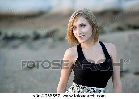 Blonde young woman on beach in Maine. View Large Photo Image Stock Photo - Blonde young woman on beach in Maine.. Fotosearch