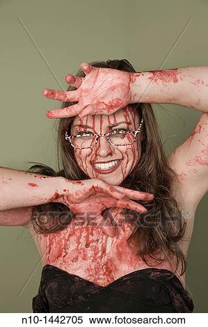 Bloody young woman wearing glasses View Large Photo Image Stock Photography - Bloody young woman wearing glasses. Fotosearch
