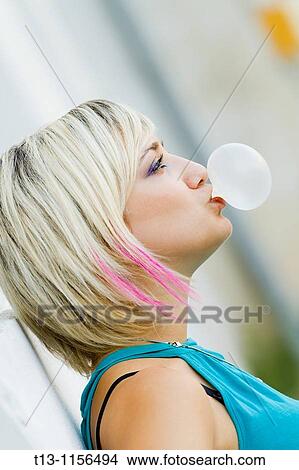 Blowing a bubble gum View Large Photo Image Picture - Blowing a bubble gum. Fotosearch