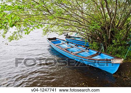 Blue boats at Loch Leane in County Kerry, Ireland, Europe View Large Photo Image Stock Image - Blue boats at Loch Leane in County Kerry, Ireland, Europe. Fotosearch