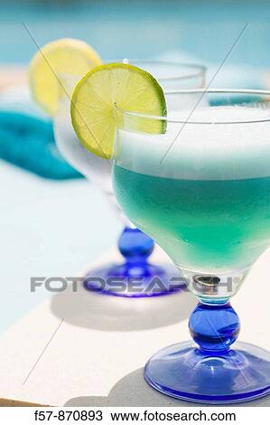 Blue cocktails by the pool View Large Photo Image Stock Image - Blue cocktails by the pool. Fotosearch