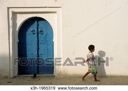 Stock Photo - blue door in the medina of Nefta, Tunisia, North Africa.. Fotosearch