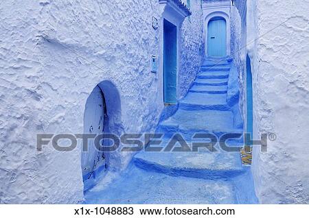 Stock Image - Blue Doorways and Steps in the Medina, Chefchaouen, Morocco, North Africa. Fotosearch