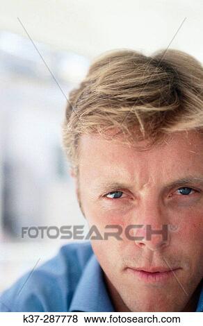 Stock Photo - Blue eyes man portrait. Fotosearch