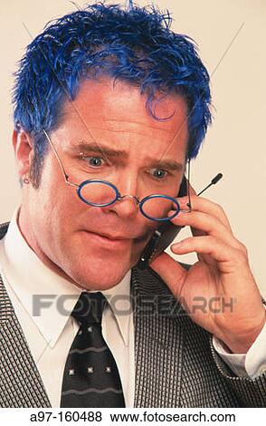 Stock Photo - Blue-haired businessman talking on cell phone. Fotosearch