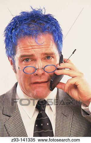 Blue-haired businessman talking on cell phone View Large Photo Image Stock Photography - Blue-haired businessman talking on cell phone. Fotosearch