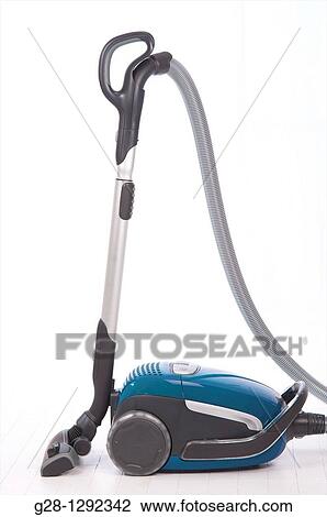 Blue Hoover, concept image of removing dust, cleaning, suppressing pollution, allergy and animal hairs on a white background View Large Photo Image Stock Image - Blue Hoover, concept image of removing dust, cleaning, suppressing pollution, allergy and animal hairs on a white background. Fotosearch