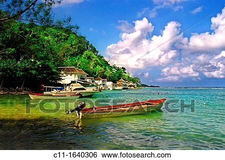 Stock Photograph - blue lagoon, with red fishing boat, jamaica, caribbean,. Fotosearch