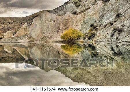 Blue Lake reflection, St Bathan? s, autumn, Central Otago, New Zealand View Large Photo Image Picture - Blue Lake reflection, St Bathan? s, autumn, Central Otago, New Zealand. Fotosearch